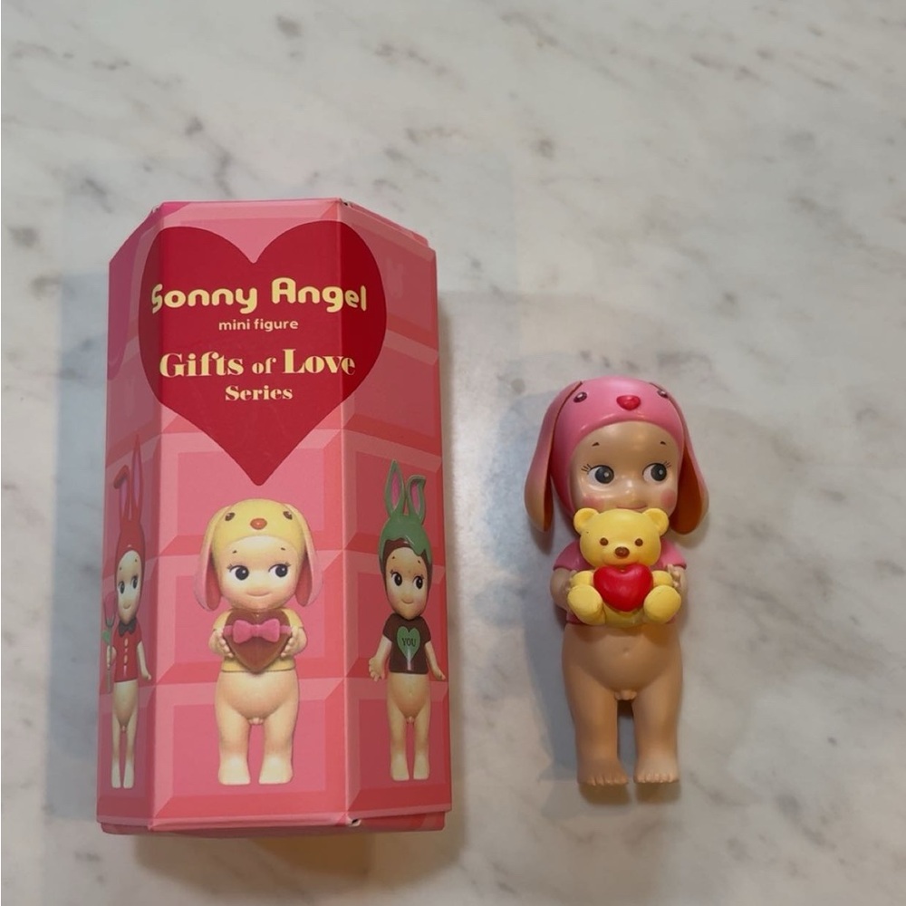 Sonny Angel Mini Figure with Pink Outfit and Yellow Teddy Bear